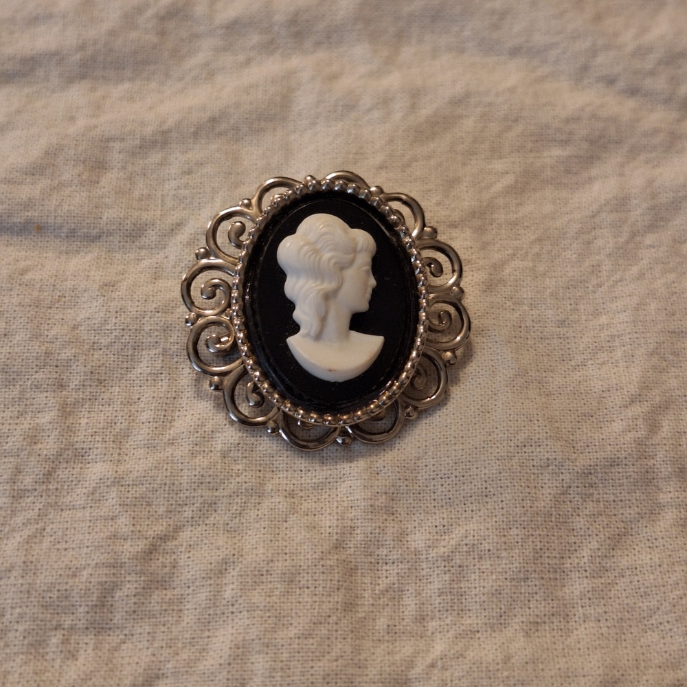 Black and silver cameo brooch
